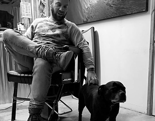 Bruno, cutting hair on the seaside in Porthleven, Cornwall