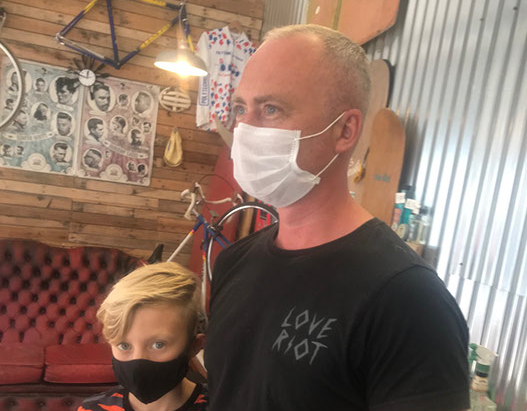 Bruno, cutting hair on the seaside in Porthleven, Cornwall