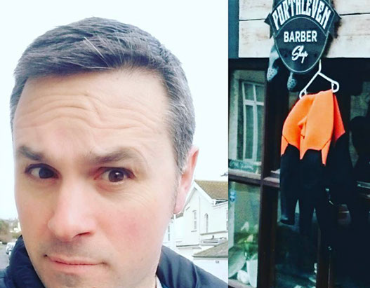 Bruno, cutting hair on the seaside in Porthleven, Cornwall